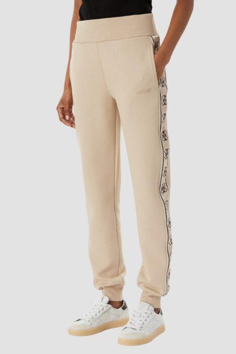 GUESS Beżowe damskie spodnie dresowe z lampasami Britney Jogger